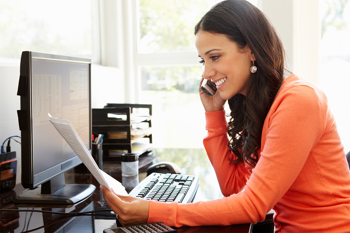 Woman discussing property management with Weichert