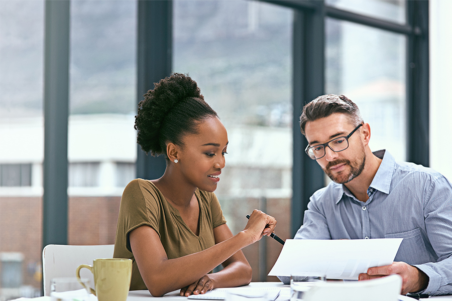 Man and woman discussing mortgage documents