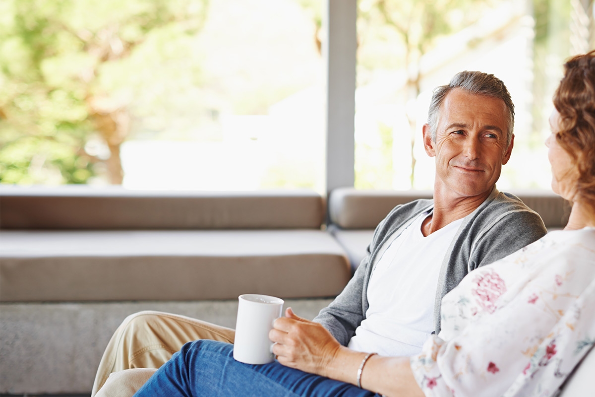Couple discussing selling their house